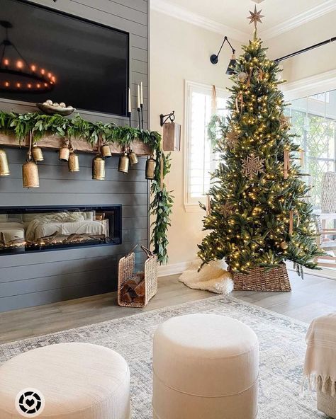 We LOVE this Christmas tree, dark shiplap, and gold bells!🤩 +TAP the link in bio for a similar look!! 📸@thedailynest #mantel #manteldecor #mantle #mantledecor #fireplace #fireplacedecor #christmasdecor #christmasdecorations #christmastree #winterdecor #livingroom #livingroomdecor #livingroomdesign #neutralhome #shiplap #modernfarmhouse #farmhouselove #farmhousedecor #farmhousestyle #farmhouseliving #cozyspaces #modernfarmhousestyle #entrwaydecor #entrydecor #farmhousechic #cottagestyle Neutral Christmas Decor, Cozy Christmas Decor, Christmas Decor Inspiration, Christmas Mantel, Christmas Mantel Decorations, Christmas Mantle, Christmas Inspo, Christmas Fireplace, Christmas Decorations For The Home