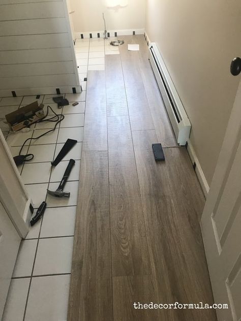 Ideas for Covering Up Tile Floors Without Removing It Tile In Basement Floor, Wood Over Tile Flooring, Tile To Match Wood Floors, How To Replace Tile Floor, Tile Floor Remodel Diy, Bathroom Wood Look Tile, Removing Ceramic Tile Floor, Replacing Tile Floor, Thresholds Between Rooms