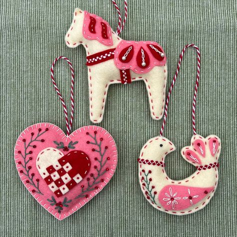 PLEASE NOTE! Physical items will not ship until the beginning of July, as I am taking a break during June. PDF items will be delivered immediately.  Delight your family and friends with a handmade ornament inspired by Scandinavian folk art. This is a PDF pattern to make my popular Scandinavian trio which includes the whimsical dala horse, folk bird, and woven heart. You will receive the patterns and complete instructions to make all three ornaments, as well as links to stitching guides and recom Scandinavian Felt Ornaments, Nordic Felt Ornaments, Homemade Felt Ornaments, Felt Christmas Ornaments Patterns Free, Felt Ornaments Patterns Free, Scandinavian Folk Art Patterns, Felt Dala Horse, Nordic Ornaments, Scandinavian Ornaments