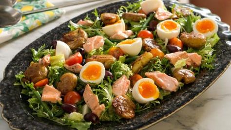 Cold-Poached Salmon Nicoise Salad with Crispy Potatoes Recipe | Valerie Bertinelli | Food Network Salmon Nicoise, Frisee Lettuce, Salmon Nicoise Salad, Poached Salmon, Nicoise Salad, Valerie Bertinelli, Crispy Potatoes, Potatoes Recipe, Cooking Food