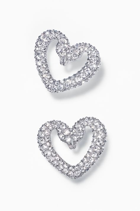 Gifts from the heart for the one you love.​ These pierced earrings represent a new direction for the iconic Swarovski swan emblem. Formed in the shape of a heart, this rhodium plated pair is designed to spark the imagination with dazzling pavé crystals. Valentine's Day | Romantic | Heart | Gift Guide | Jewelry | Crystal | Must-have | Statement | Bold | Fashion Swarovski Heart Earrings, Gifts From The Heart, Swarovski Swan, Rock Rings, Swarovski Heart, Dance Necklace, Expensive Jewelry Luxury, Romantic Heart, Jewelry Luxury