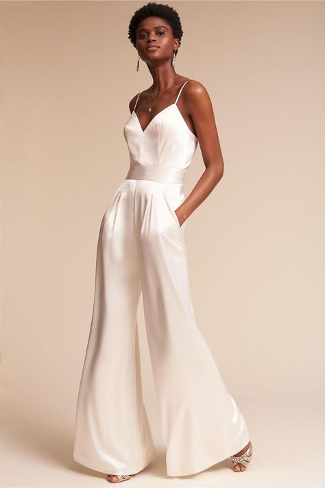 White silk jumpsuit! Perfect for the modern bride! Love this for a wedding reception! Wedding Reception Outfit For Bride, Reception Outfit For Bride, Jumpsuit Wedding Dress, Bride Jumpsuit, Wedding Reception Outfit, Wedding Pantsuit, Wedding Pants, Rehearsal Dinner Outfits, Reception Outfit