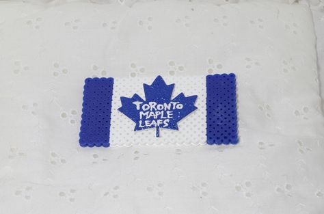 Toronto Maple Leaf flag Perler bead magnet Toronto Maple Leafs Logo, Maple Leaf Flag, Toronto Maple, Toronto Maple Leafs, Maple Leafs, Hockey Teams, Perler Bead, Craft Activities For Kids, Sports Gifts