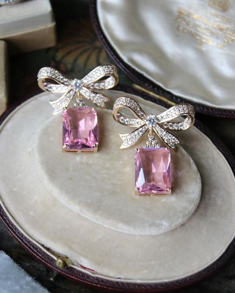 Elevate your bridal look with these magnificent earrings, adorned with regal bow accents and radiant pink simulated diamonds. Also available in blue! #EDENLUXEBridal #weddingearrings #earringdesigns #bridalearrings #bridaljewelry #bowaccessories #pinkaccessories Bow Diamond Earrings, Bridal Era, Pink Diamond Earrings, Emerald Earring, Pink Emerald, Blue Emerald, Bow Style, Diamond Bows, Pink Accessories