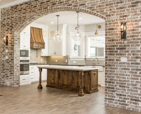 Arched brick wall between LR and kitchen Wide Oak Flooring, Archways In Homes, Brick Archway, Brick Accent Wall, Dreams To Reality, Brick Arch, College Station, Farmhouse Interior, Their Story