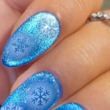 Vettsy on Instagram: "❄️Iced Blue Snowflakes Nails that give you the most stunning winter shine ✨ ✨Super Cat Eye Gel ✨Solid Gel-123 Frozen ✨Nail Stickers-Hollow Snowflake 👉 Shop the same nail supplies via my bio or visit vettsy.com Follow @vettsystore & @vettsynails for more nail inspiration 🧚‍♀️ 👭Tag friends who would like this👭 #vettsynails #nailsupply #nailsupplies #nailsathome #diynail #bluenails #bluenails💙 #snowflakenails #snowflakes #hollownails #glitternails #cateyenails #magneticnails #magneticpolish" Blue Cat Eye Christmas Nails, Cat Eyes Christmas Nails, Snowflake Nails Blue, Cat Eye Christmas Nails, Frozen Nail Art, Ice Nails, Snowflakes Nails, Frozen Nails, Snowflake Nail Art