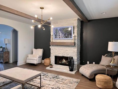 Black Accent Wall With White Stone Fireplace - Soul & Lane Light Stone Fireplace Dark Wall, Black Accent Wall With White Fireplace, White Stone Fireplace Black Wall, Black Rock Wall Fireplace, Stone Feature Wall Living Room, Family Room Stone Accent Wall, Chevron Fireplace Wall Black, White Stone Fireplace, Black Accent Wall Living Room