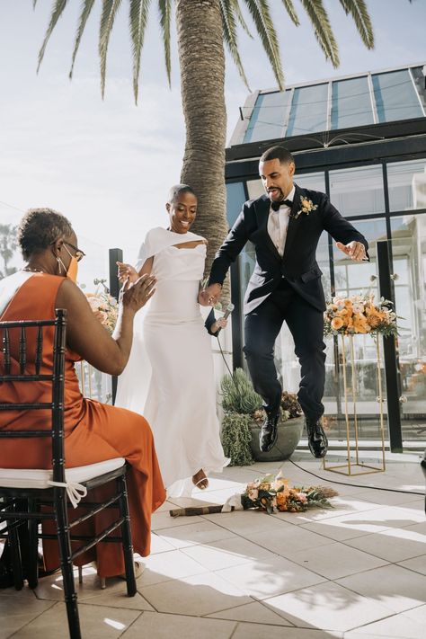 Jumping the Broom Jumping The Broom Wedding, Broom Wedding, Jump The Broom, Jumping The Broom, Folk Culture, African Ancestry, Floral Wedding Cake, Socal Wedding, Ocean Views