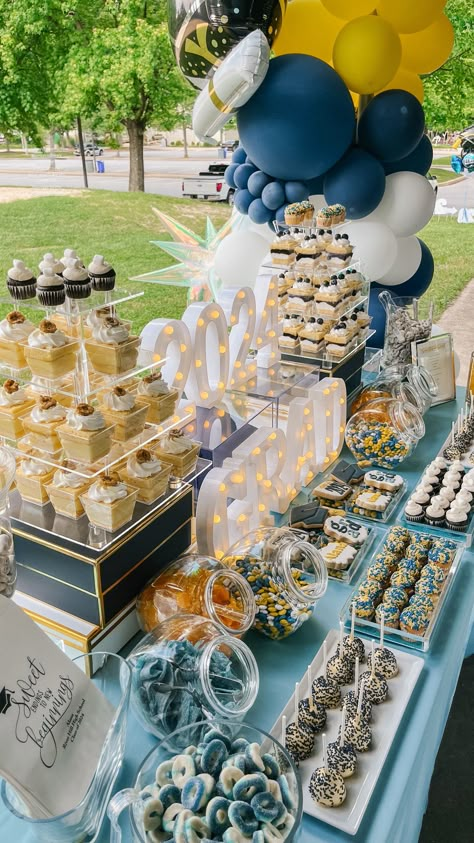 🎉 Looking for unique ways to celebrate your grad? Explore our creative candy buffet ideas to add a sweet touch to your party. Get inspired today! 📌 #GraduationParty #CandyBuffet #PartyDecor #DessertTable #EventPlanning #GradPartyIdeas Outside Grad Party Ideas, Sports Themed Dessert Table, Graduation Sweets Table Ideas, Grad Party Drink Ideas, Junior High Graduation Party Ideas, Candy Table For Graduation Party, Grad Party Sweet Table, Blue And Yellow Candy Table, Graduation Party Sweet Table Ideas