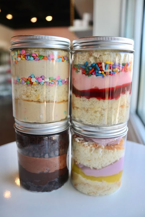 We offer many yummy flavors of cake in the jar! Bakery Container Ideas, Jar Desserts Packaging, Bake Sale Goodies Ideas, Mini Cake Flavors, Birthday Cake In A Jar, Sell Baked Goods From Home, Desert Packaging Ideas, Cake Small Business, Small Dessert Business Ideas