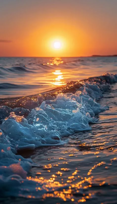 Serene ocean scene with vibrant sunset colors and gentle waves. Beaches And Sunsets, Beautiful Beach Background, Ocean With Sunset, Sun Set Wallpaper, Sunrise Over Ocean, Beach Waves Sunset, Sun And Ocean, Sunset Over Water, Beautiful Sunset Pictures