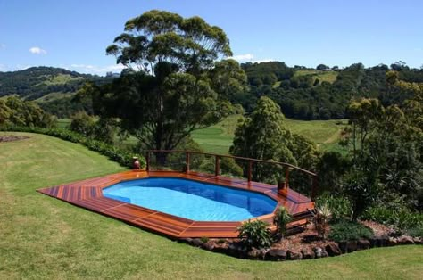 Mom & Ann K--Above ground pool built into hillside with deck...as good as in-ground--For farm or for Beech House! Fun for Grandgirls!! Pool Stuff, Swimming Pool Landscaping, Above Ground Pools, Wooden Deck, Above Ground Pool Landscaping, Outdoor Pools, Ground Pools, Above Ground Pool Decks, Dream Yard