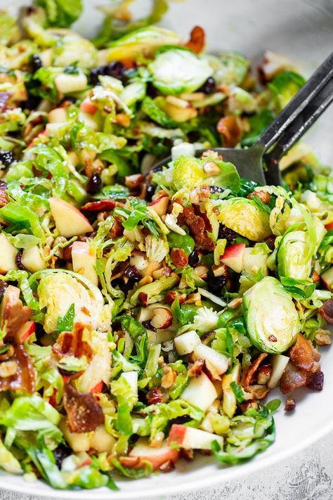 This shredded Brussels sprouts salad is loaded with so many delicious things!  Sweet chopped apples, crispy bacon, toasted hazelnuts and a sweet tangy apple vinaigrette.  It’s paleo, dairy-free, with a Whole30 option and perfect for a crowd or as a make ahead lunch. Shredded Brussels Sprouts Salad, Apple Vinaigrette, Make Ahead Lunch, Shredded Brussel Sprout Salad, Shredded Brussels Sprouts, Brussel Sprout Salad Recipes, Brussels Sprouts Salad, Shredded Brussel Sprouts, Sprouts Salad