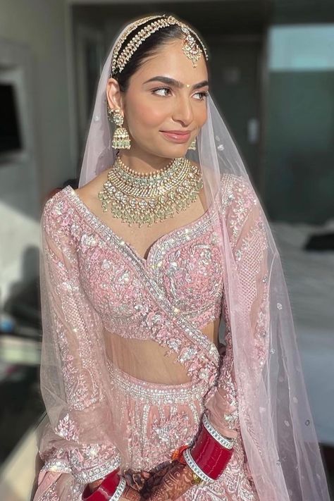 The minimal makeup, pastel pink lehenga & a hint of red bridal chooda to make it pop
- we are pinning this bridal inspiration right away! When it comes to wedding lehengas, red has always been a favourite with brides. But off late, brides are giving the traditional red lehenga a miss and opting for a different and unique hue when it comes to picking up their bridal lehenga – powder pink! A pale shade of pink that is in the pastel family has been a bridal favourite off late for your wedding day. Manushi Chiller In Prithviraj, Pastel Bridal Jewellery, Light Pink Wedding Lengha, Pale Pink Lehenga, Light Pink Wedding Lehenga, Minimal Chooda, Baby Pink Lehenga Bridal, Pastel Pink Lehenga Bridal, Jewellery With Pink Lehenga