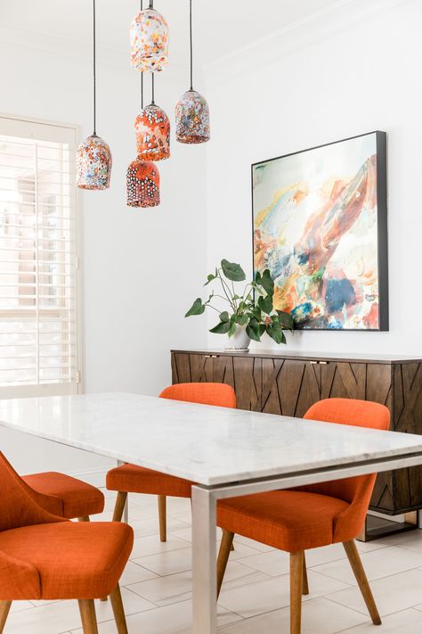 Dining rooms with orange accents - upholstered chairs & blown glass lighting by PepperJack Interiors - Lookbook - Dering Hall Orange Chair Dining Room, Desine Room, Orange Accents Living Room, Dining Room Orange, Room Desine, Orange Dining Room Chairs, Orange Dining Room, Orange Dining Chairs, Blown Glass Lighting