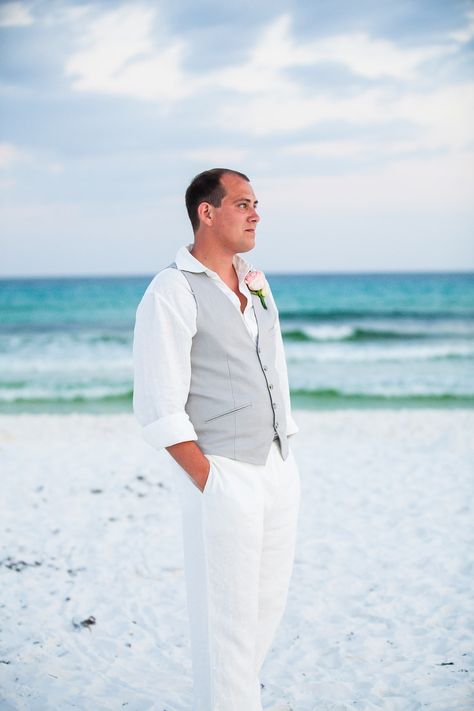 A beach wedding is a magical, romantic affair. It’s a celebration of love and commitment, and a beautiful way to start a lifelong journey. But if you’... Destination Wedding Attire, Outfit For Beach, Beach Wedding Groom Attire, Mens Beach Wedding Attire, Beach Wedding Men, Beach Wedding Groomsmen, Beach Wedding Groom, Beach Wedding Suits, Beach Wedding Outfit