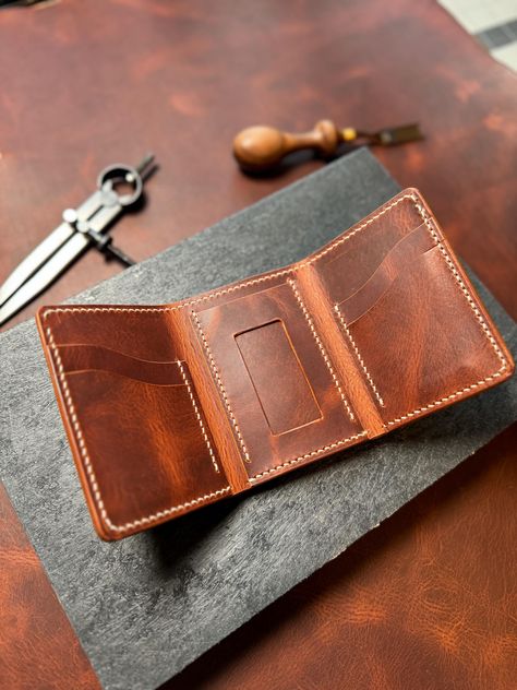 This handmade classic trifold wallet is sourced from one of the most luxurious leathers in Italy and USA. Meant to last many years and develope a wonderful patina over time! Clip Wallet, Money Clip Wallet, Bifold Wallet, Trifold Wallet, Purse Wallet, Leather Wallet, Patina, Wallets, Accessory Gift