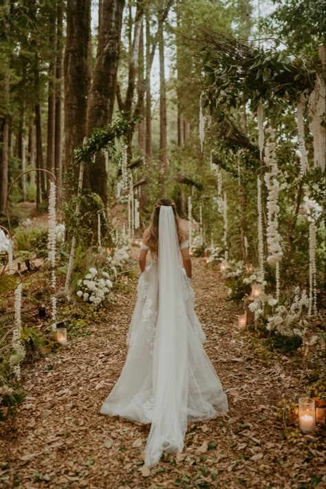 Girl walking up the aisle in forest for wedding Forest Wedding Wedding Dress, Utah Forest Wedding, June Forest Wedding, Wedding In The Woods Dress, Twilight Inspired Makeup, Alter Ideas For Wedding, Whimsical Forest Wedding Dress, Woodsy Wedding Ceremony, Ethereal Forest Wedding