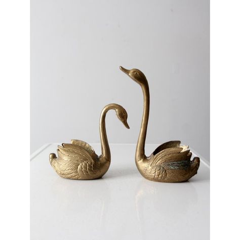 These vintage mid 20th century brass swan planters add a beautiful decorative touch to any room. Crafted from cast brass with intricate detailing, they can be used as cachepots or decorative bowls.    MEASUREMENTS Swan 1:  8.5" x 3.25" x 7.75" H  ..  21.6 cm x 8.3 cm x 19.7 cm Swan 2:  8.25" x 3.25" x 11.5" H  ..  21 cm x 8.3 cm x 29.2 cm Brass Swans Decor, Swan Accessories, Swan Nursery Decor, Mid Century Glam, Wooden Crate Boxes, Swan Planter, Vintage Brass Decor, Swan Decor, Brass Swan