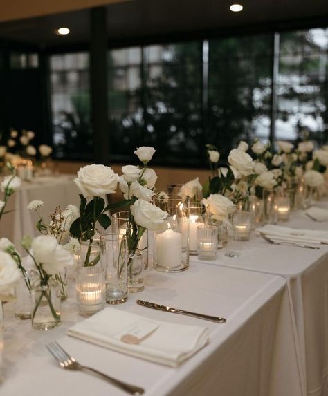 Simple Romantic Table Decor, White Flower Centerpieces Wedding Simple, Modern Minimal Wedding Flowers, Wedding Table Decorations No Flowers, Simple White Table Setting, Minimal Floral Centerpieces Wedding, Minimal White Wedding Decor, Modern White Rose Wedding, Rose And Candle Centerpieces