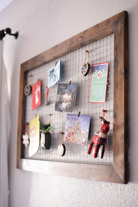 DIY Wood and Chicken Wire Christmas Card Holder | Our Handcrafted Life    This super versatile DIY project that could be really used throughout the year, but around the holidays I love to use it as a DIY Chicken Wire Christmas Card Holder. This Christmas card display allows all those Holiday cards to be wall decor instead of sitting in a pile. Hand ornaments, pictures, kid's art, and cards on this framed chicken wire piece that's part wall art and part organization. Chicken Wire Picture Display, Chicken Wire Photo Display, Farmhouse Christmas Decor Diy, Picture Holder Diy, Diy Chicken Wire Frame, Diy Wood Picture, Chicken Wire Display, Wood Picture Holder, Ornaments Pictures