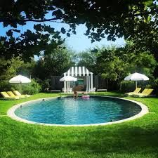 Habitually Chic® » Lauren Santo Domingo's Southampton Retreat Oval Swimming Pool, Lauren Santo Domingo, Hot Tub Time Machine, Oval Pool, Tub Time, Round Pool, Family Estate, Natural Pool, Garden Pool