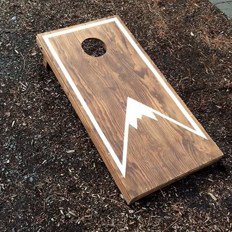 Cornhole Mountain Designs, Simple Corn Hole Board Designs, Cornhole Boards Designs Mountains, Corn Hole Boards Designs Mountains, Cornhole Boards Designs Stained, Cornhole Board Designs Diy, Cool Cornhole Designs, Cornhole Paint Ideas Diy, Mountain Cornhole Boards