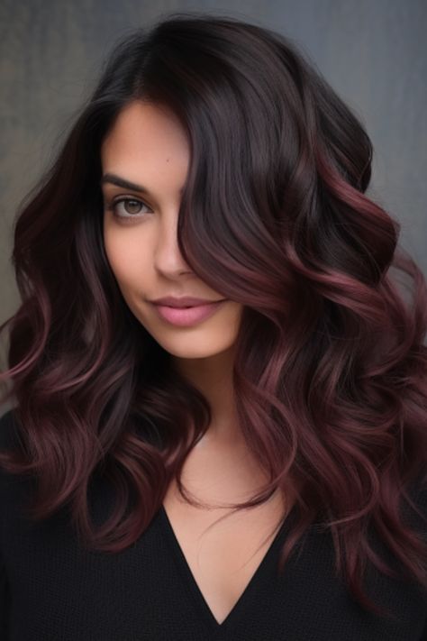 Deep burgundy balayage on dark hair is a rich and lush option for people seeking a drastic color change. This style is perfect when you want a supple balayage for your dark hair. Click here to check out more gorgeous balayage for dark hair ideas. Dark Hair To Red Balayage, Red Burgundy Balayage Hair, Hair Color Changes For Dark Hair, Brown Hair Burgundy Balayage, Dark Brown Burgundy Hair Balayage, Cherry Coke Balayage Dark Brown, Hair Styles For Dark Brown Hair, Burgundy Balayage On Brown Hair, Brown And Red Balayage Hair