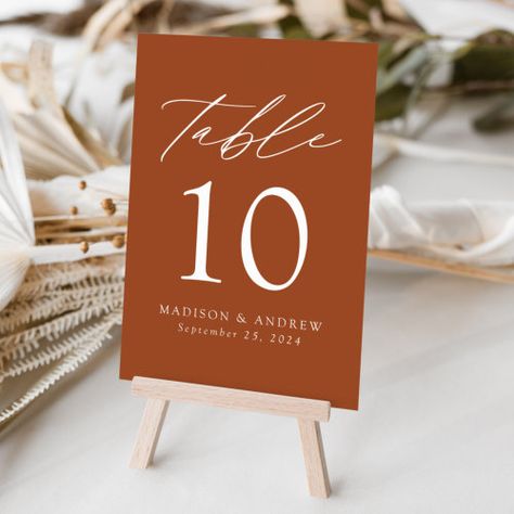 $1.30 | Terracotta Modern Elegance Wedding #wedding, table number, modern, minimalist, simple, calligraphy script, minimalist wedding, elegant, trendy, terracotta Elegant Terracotta Wedding, Terracotta Table Numbers, Terracotta Table Setting, Wedding Party Table Ideas, Valentine Banquet, Modern Elegance Wedding, Minimalist Wedding Table, Color Terracota, Number Gifts