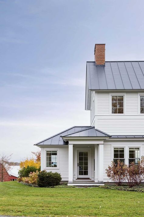 A peek into this timeless Vermont farmhouse with beautiful living spaces Colonial Country House, Vermont Country House, Vintage White Farmhouse Exterior, White Farmhouse Metal Roof, Dutch Farmhouse Exterior, Timeless Farmhouse Exterior, White House With Metal Roof, 1800s Farmhouse Exterior, Farmhouse Renovation Exterior