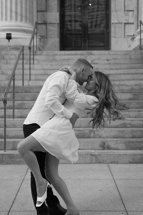 Editorial engagement photoshoot in downtown Tampa. The bride wears a short white bridal dress and the groom wears classic black pants and a white dress shirt Engagement Photoshoot Ideas Editorial, Engagement Street Photography, Short Wedding Dress Poses, Women Engagement Outfits, Engagement Photoshoot Ideas Charleston, Engagement Photo Elegant, Italian Style Engagement Photos, Short Dress Wedding Photos, Lauren Giraldo Engagement