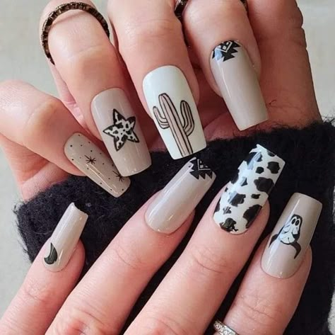 Black And Gold Cow Print Nails, Western Print Nails, Current Nail Designs, Black Western Nail Designs, Almond Shape Western Nails, Cowprint Nail Design Almond, Fall Cowgirl Nails, Western New Years Nails, Rodeo Nails Designs Westerns