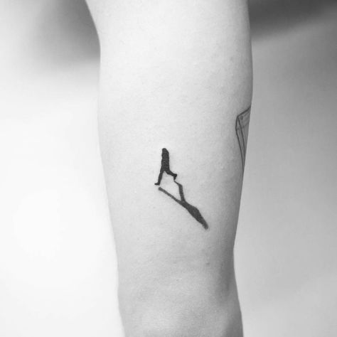 Black tattoo of a walking man’s silhouette Walk In Tattoos, 22 Tattoo, Wrist Tattoos For Guys, Silhouette Tattoos, Tattoos Geometric, Modern Tattoos, Small Tattoos For Guys, Tattoo Kits, Sleeve Tattoos For Women