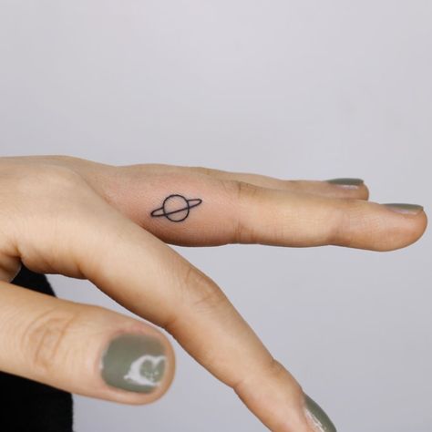 STUDIOBYSOL_Pu-reum on Instagram: “Saturn 🪐 [ Hand poked ]” Dumbest Tattoos, Nova Tattoo, Saturn Tattoo, Ear Tattoo Ideas, Ear Tattoos, Small Tats, Small Pretty Tattoos, Stick N Poke Tattoo, Poke Tattoo