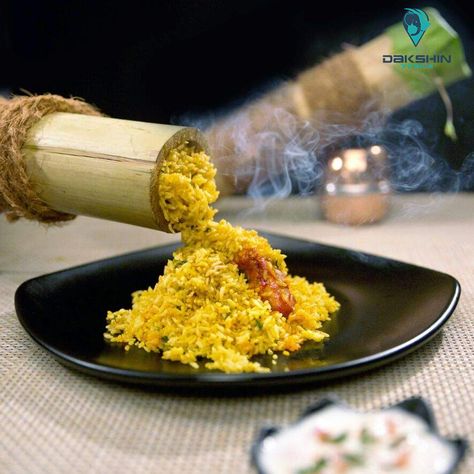 Bamboo Biriyani - Rice and chicken mixed in spices stuffed into a piece of raw bamboo log that goes on natural fire till outer later becomes charcoal, is Bamboo Chicken Biryani as made by the tribes of India.Result is the rich flavour of bamboo extracted by the circulating steam while aroma of food itself remains largely contained. #DakshinTrails #KeralaFoods #BambooBiriyani #KeralaTourPackages #KeralaCuisine #GoKerala #HiddenKerala Bamboo Biryani, Tribes Of India, Bamboo Rice, Rice And Chicken, Bamboo Extract, Chicken Biryani, Biryani Recipe, Biryani, Indian Food