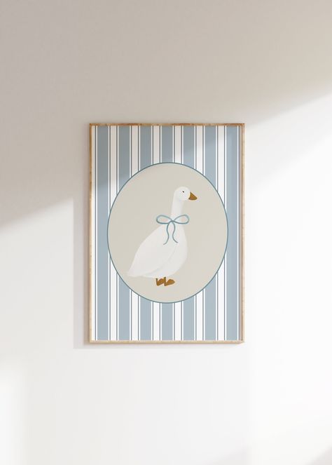 This Listing is for a Cute Goose with a light blue bow Wall Art Printable, with a light blue striped background. Perfect for a gender neutral kid's room, playroom, or nursery! I have a lot of similar and complimentary pieces, so please check out my shop! PLEASE NOTE, THIS IS A DIGITAL DOWNLOAD ONLY. No physical product will be shipped. All files are available immediately after purchase for download. You will receive a PDF with a download link. Just download, print, and frame! Once your payment i Blue Nursery Art, Vintage Goose Nursery, Blue Vintage Nursery, Goose Themed Nursery, Vintage Blue Aesthetic, Stripes Nursery, Goose Poster, Aesthetic Nursery, Light Blue Nursery