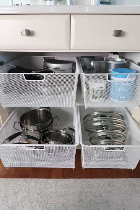 Maximize cabinet storage with mesh pull out drawers! Step by step instructions on how to install multiple drawers inside of a cabinet. STEP 1: Measure the inside cabinet width between hinges/door frame and depth of cabinet to determine the amount of space you have for mesh drawers. The inside of my cabinet was 30 inches wide between the concealed hinges and 23 inches deep. I was able to order the deepest option they make and had space for 4 drawers: 2 ea. Elfa Narrow 2-… Under Cabinet Dish Storage, Kitchen Sink Drawer Storage, Drawer In Cabinet, Bottom Kitchen Cabinet Organization, Lower Drawers In Kitchen, Under Cabinet Kitchen Storage, Turn Cabinets Into Drawers, Kitchen Bottom Cabinet Organization, Under Cabinet Storage Kitchen