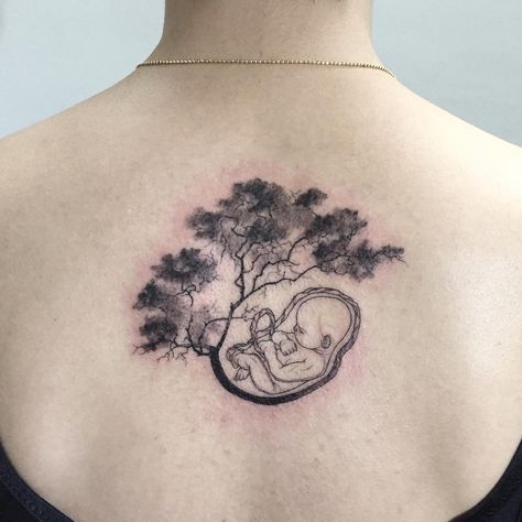 No photo description available. Embryo Tattoo, Tattoo Mujer, Mother And Baby Tattoo, Breastfeeding Tattoo, Baby Tattoo, Mommy Tattoos, Mens Shoulder Tattoo, Baby Poster