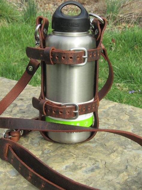 Updated with buckles and shoulder pad Adjustable Full Grain Water Buffalo leather water bottle carrier with shoulder strap, Stainless Steel by GrayEagleLeather on Etsy Leather Water Bottle, Bottle Sling, Water Bottle Carrier, Water Bottle Holder, Diy Water, Bottle Carrier, Water Buffalo, Beautiful Belts, Water Bottle Holders