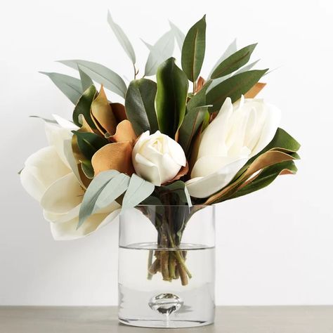 Gracie Oaks Real Touch Magnolia & Eucalyptus Mixed Floral Arrangement in Glass Vase | Wayfair.ca Magnolia Flower Home Decor, Faux Magnolia Arrangement, Minimalist Flower Arrangement Modern, Kitchen Floral Arrangements, Magnolia Flower Arrangement, Luxury Glassware, Eucalyptus Arrangement, Sogetsu Ikebana, Glass Cylinder Vases