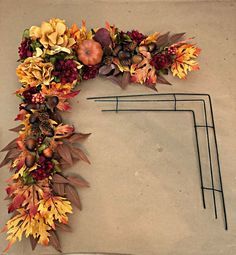 DIY Fall Door Decor - Decorate your front door with festive fall decor. All items can be purchased at the dollar store which means this project is gorgeous and budget friendly. #fallporchdecordiy #diy #cheap #rustic #porch #frontdoor #fall #autumn #seasonaldecor #decorations #hanger #display #wreaths #diy #frontporches Corner Wreaths Diy, How To Make An Autumn Garland, Dollar Tree Fall Decor Ideas Front Porch, Wreaths With Birds, Fall Door Garland Diy, Diy Fall Door Decor, Square Wreaths For Front Door, Outside Door Decor Front Entry, Easy Fall Wreaths Diy