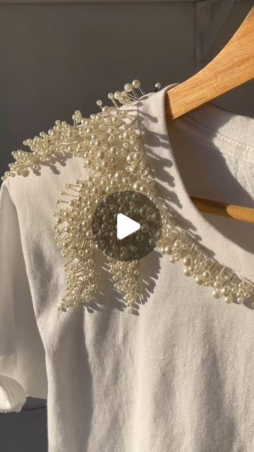 Michael Samudio on Instagram: "The Sargasso shirt.   Hand-embroidered coral epaulette on white pure cotton shirt.   More styles to come as a part of a collection of the White Shirt Series Volume 2.   Plus proceeds from the style of this series will go to educational fund for my team’s little tots.   Would you like to receive the e-catalog for this series?" Festive Semi-stitched Handwork Tops, Festive White Top With Pearl Embroidery, Traditional White Tops With Pearl Embroidery, White Semi-stitched Tops With Resham Embroidery, Hand Embroidered Shirt, Luxury Designer Pearl Embroidered Tops, Embroidered Shirt, White Shirt, Cotton Shirt