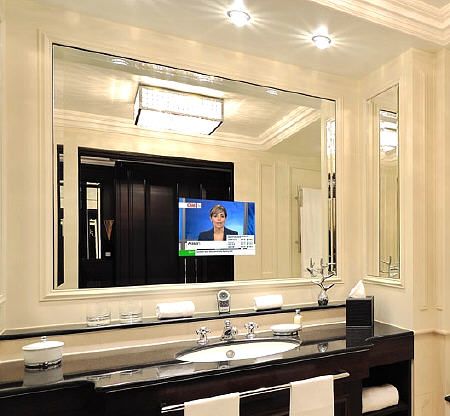 Get caught up on the news while getting ready. How To Fit TV Into Any Interior – 25 Cool Ideas | Shelterness Wall Mount Tv Stand, Tv In Bathroom, Hidden Tv, Hotel Lounge, Blue Bathroom, Wall Mounted Tv, Bathroom Storage, Modern Bathroom, The Wall