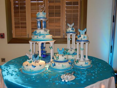 15th Birthday Cake w/butterflies, columns, blues. Blue Quinceanera Ideas, Forest Quince, 15 Cakes, Sweet 15 Cakes, Quince Blue, Quinceanera Reception, 15th Birthday Cake, Light Blue Butterfly, Quince Cakes