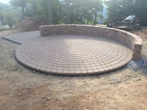 A circle shaped concrete paver patio, with attached semi-circular seating wall. By Carefree Landscapes. Circle Cement Patio, Semi Circle Patio, Yard Upgrades, Brick Patio Ideas, Circular Seating, Circle Patio, Paver Patio Ideas, Seating Wall, Concrete Paver Patio