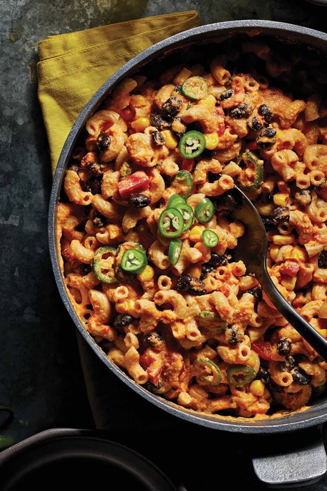 Serrano chiles add a relatively mild heat to this creamy chili mac ’n’ cheese, making it a family-friendly option for dinner. Whole wheat elbow noodles are tossed in a simple dairy-free cheese sauce and peppered with sweet corn kernels, tender roasted bell peppers, and black beans for the ultimate Tex-Mex pasta dish. A touch of lime juice adds zesty acidity to the denser ingredients, and you could even top each portion with extra sliced chiles to dial up the heat. Chili Mac N Cheese, Vegan Chili Mac, Vegan Pastas, Creamy Chili, Elbow Noodles, Roasted Bell Peppers, Asian Noodle Dishes, Curry Recipes Vegetarian, Chili Mac And Cheese