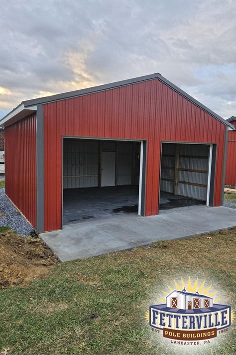 A wonderful small building just finished for a local parish, featuring 2 steel overhead doors and 1 entry door. Reflective barrier under the roof metal prevents condensation inside. Includes a 4" Concrete Floor with front apron. Building solutions for all sizes! Pole Building Garage, Steel Garage Buildings, Barn Garage Plans, Pole Barn Designs, Pole Barn Garage, Garage Construction, Pole Buildings, Small Building, Pole Barns