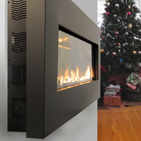 This slim fireplace model mounted on the wall allows for more floor space. Wall Mounted Gas Fireplace, Gas Wall Fireplace, Small Gas Fireplace, Propane Gas Fireplace, Portable Electric Fireplace, Fireplace Vent, Vented Gas Fireplace, Natural Gas Fireplace, Black Brick Wall