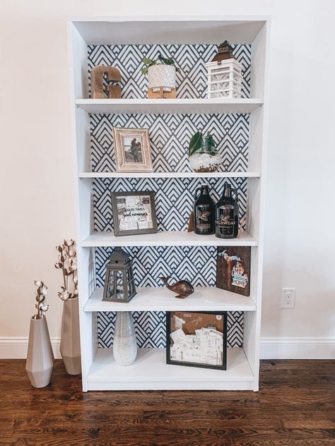 Turned a simple black bookshelf into an eye catching living room piece Bookshelf Contact Paper, Peel And Stick Wallpaper Bookshelves, Contact Paper Bookshelf, Bookshelf Refurbish Ideas, Bookshelf Makeover Diy, Diy Contact Paper, Wallpaper Bookshelf, Bookshelf Makeover, Black Bookshelf