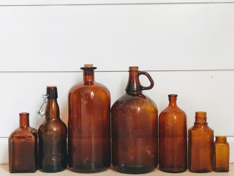 Amber Jars Decor, Brown Bottle Decor, Amber Bottles Decor, Amber Glass Decor, Amber Vases, Vintage Bottles Decor, Outside Fall Decor, Brown Glass Bottles, Amber Glassware